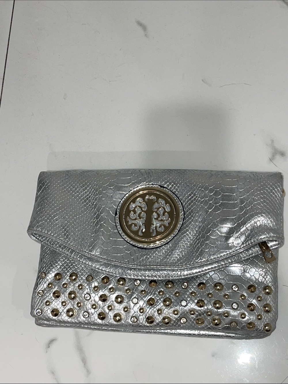 Beautiful vintage gray/silver handbag with stones on top of it